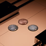 Three watch faces prior to assembly