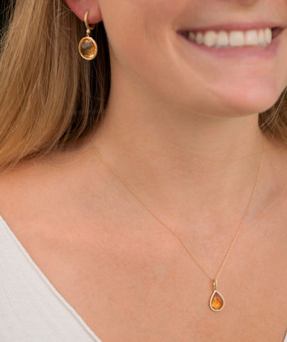 Woman Wearing November Birthstone Citrine Earrings and Pendant Necklace