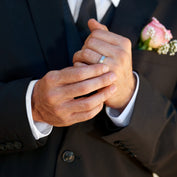 Groom wearing his wedding band