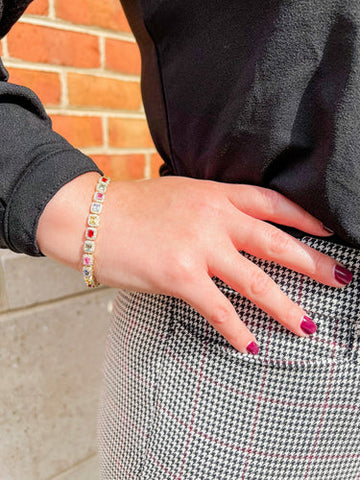 Woman Wearing Business Clothes with Rainbow Sapphire Bracelet